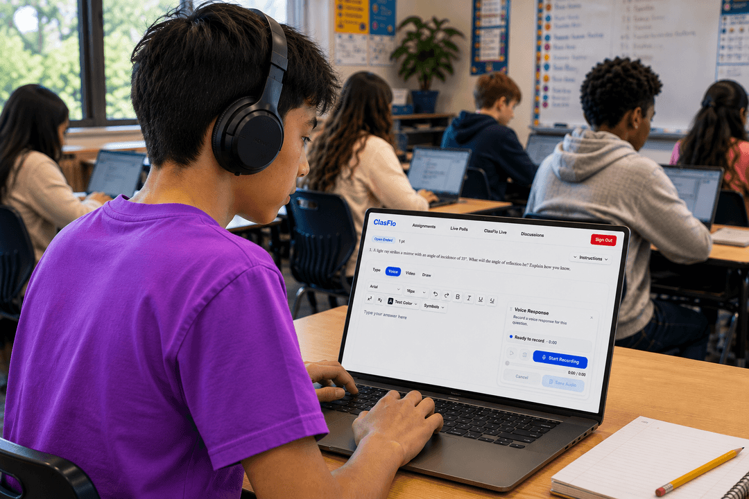 Student wearing headphones working on a laptop in class